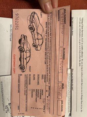 My slip that indicates the car was damaged before leaving the lot.