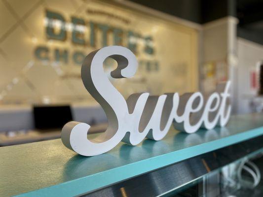 "Sweet" sign at the counter