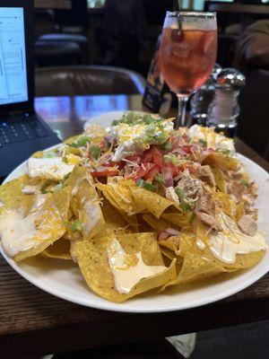 the jumbo nachos were very large and i could only finish half of them as one person and i really enjoyed the rose sangria!