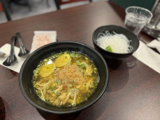 Yellow chicken soup with clear noodles