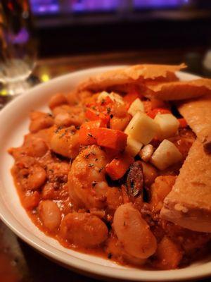 Prawns Cassoulet:  Prawns served over gigande beans, bacon, seasonal vegetables.