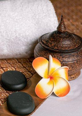 Hot stone massage helps relaxation and ease tense muscles.