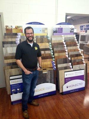 David A. standing next to one of Flooring HQ's luxury vinyl plank (LVP) flooring displays.