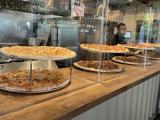 Pizza-by-the-slice display case - lots to choose from