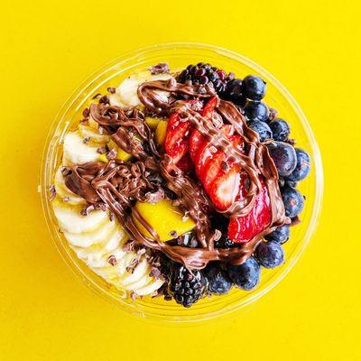 Build-your-own bowl with bananas, blueberries, blackberries, strawberries, mango, honey, and Nutella