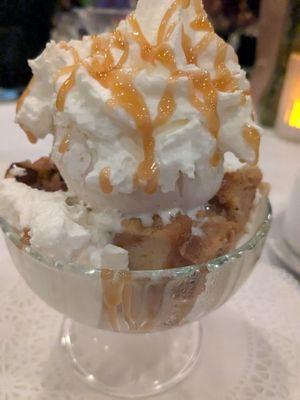 Homemade bread pudding with vanilla ice cream, whipped cream and caramel drizzle.