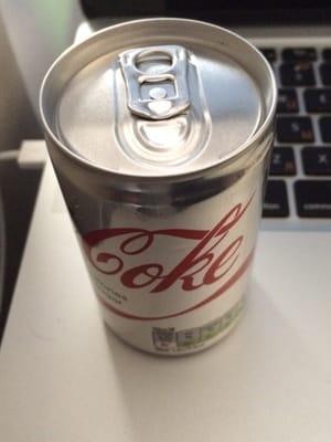 Cute tiny "juice can" size soda containers served on a BA flight.