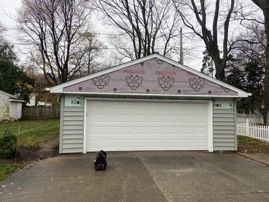 Tear off existing alum. siding, insulate with exterior fanfold & replace with new vinyl.