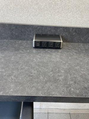 The r counter where you can charge your phone or work on your laptop