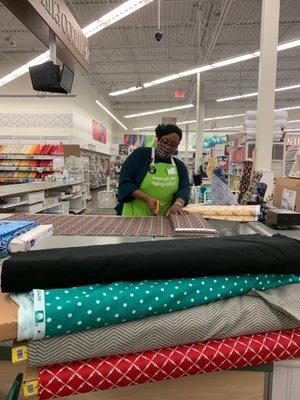 Floria is helping cut our fabric.