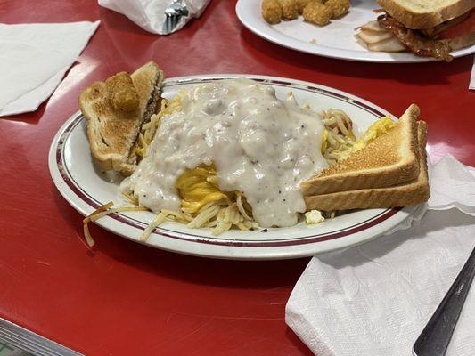 Eggs with cheese, sausage & bacon; smothered in sausage gravy,