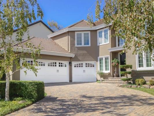 RW Garage Doors | Custom Wood Garage w/ Arched Windows
 
   a href="https://www.rwgaragedoors.com/custom-wood-carriage-house-garage-doors