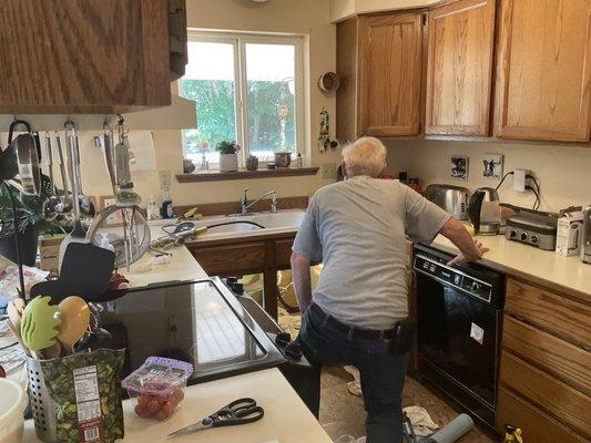 George replacing kitchen faucet