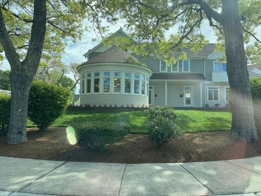 Exterior.  Round section is dining room area. Nice view and lighting lovely.