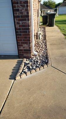 Rock bed with decorative edging.