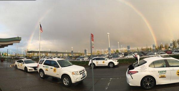 Very bright rainbow from Eugene Airport. Eugene Airport Taxis stand by @ Eugene Airport.