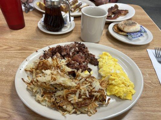 Corn beef and hash comes with eggs and toast. Added a side of hash browns to share.