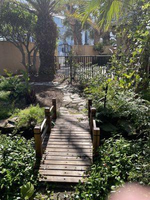 Footbridge over stream with Koi!