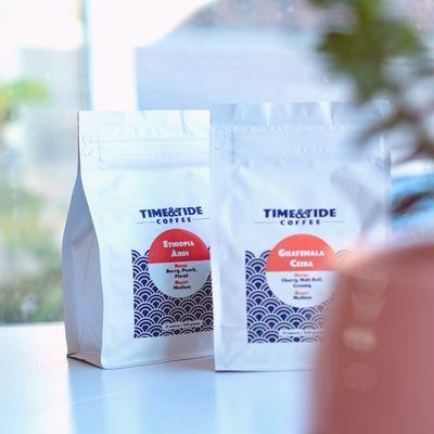 Bags of Time & Tide Coffee. Time & Tide Coffee is roasted in small batches on the Pepperell Mill Campus in Biddeford, ME.