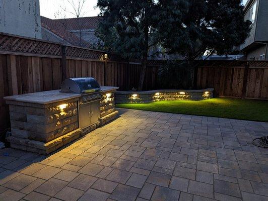 Custom BBQ, seat wall, with low voltage lights, pavers patio  , Synthetic turf!