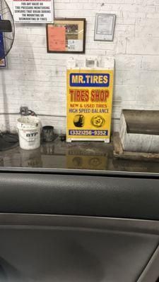 Sign inside of the garage at Mr. Tires.