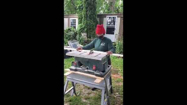 Here we see Al-Lanna cutting window trim for a window install on a weatherization job!