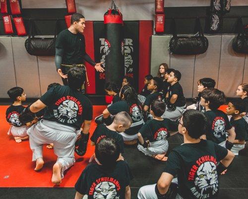 Coach Vlad teaching our beginner kickboxing tigers about consistency and having a non-quitting spirit.