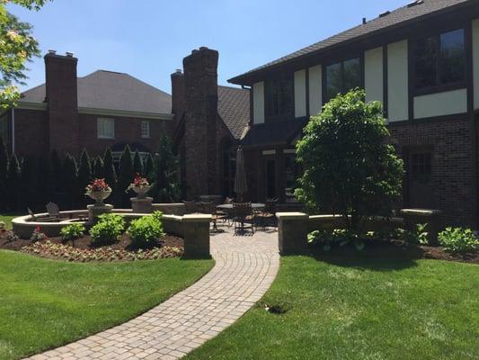 Outdoor living space including paver patio and outdoor fire pit