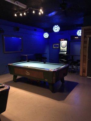 2 pool tables and a dart board.