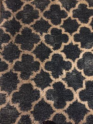 Area rug still dirty after cleaning! Left side where foot traffic is- brown, right side white! Several areas on carpet like this as well!