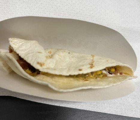 Breakfast Taco with Bacon? Is this what 2.99 Dunkin' taco looks like? I will not even give a dime.