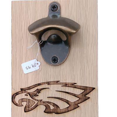 Bottle opener with a Baltimore Raven on it.