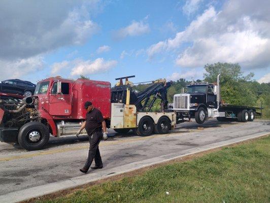 We use one of the older trucks to go get truck 93 our flatbed 30-ft rollback Peterbilt