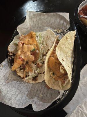 Fish tacos! Not spicy. The slaw and sauce was a perfect pair. I could have eaten 3 more.