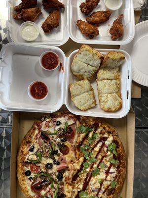 1/2 Supreme 1/2 bbq pizza, cheesy garlic bread, 1/2 hot wings, 1/2 mild wings