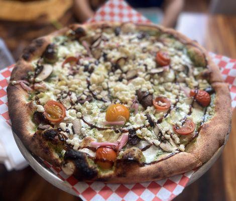 Pesto pizza with goat cheese and Mac nuts -interesting but not for me