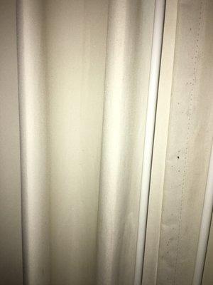 Smells like dogs and holes in curtains super dirty