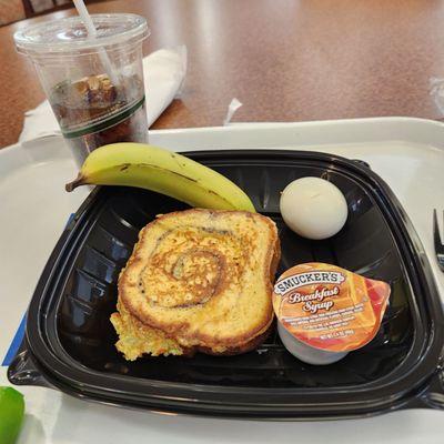 French toast, hard boiled egg, banana, and diet Pepsi