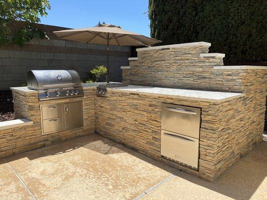 Custom BBQ Island built up to hide pool equipment