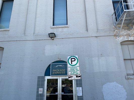 Two dedicated parking spots for Greyhound Package Express. Near the entrance.