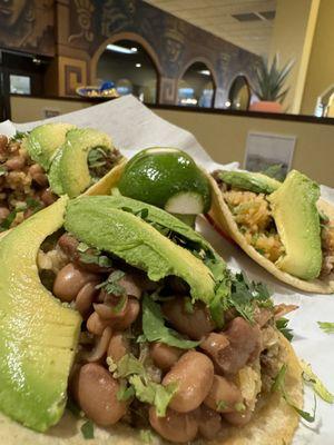 Carnitas Tacos, (whole beans and cilantro toppings) add avocado