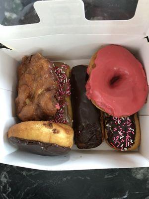 Apple fritter, maple long John, chocolate long Johns, strawberry glazed, and a cream filled chocolate glazed donut! Yum yum