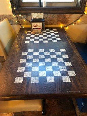 This is a checkers table to have fun with at the great stop.