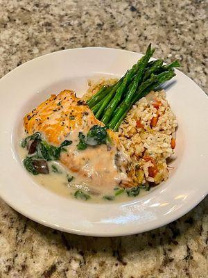 Salmon Florentine with rice pilaf and asparagus.