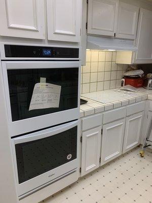 New wall oven, cooktop and range hood.