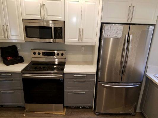 Full kitchen install, refrigerator, microwave, range, dishwasher