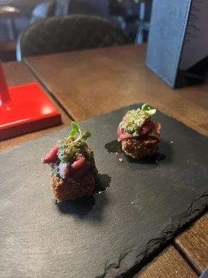 Amuse bouche - carpaccio on deep fried polenta cake