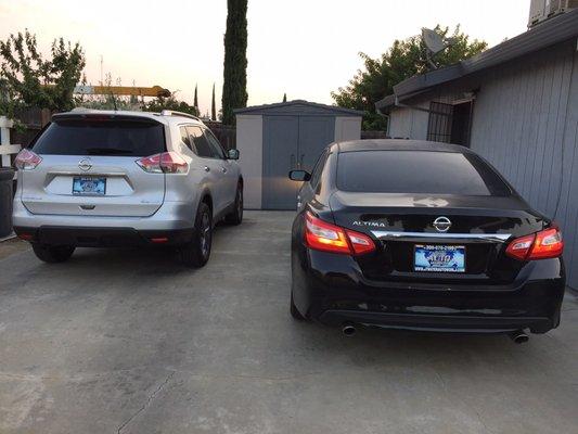 My Nissan Rogue and the lady's Nissan Altima!