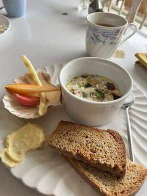 Second course of breakfast: baked eggs with local goat cheese, spelt toast, lightly pickled veggies