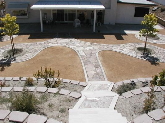 Concrete curb containing flagstone walkway